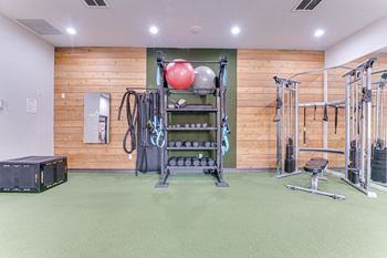 Fitness center with cable equipment and weight storage